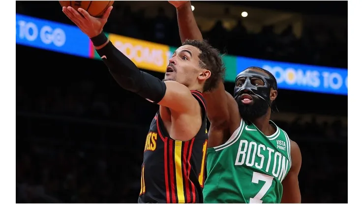 Trae Young #11 of the Atlanta Hawks drives against Jaylen Brown #7 of the Boston Celtics