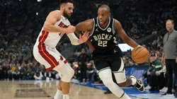 Khris Middleton #22 of the Milwaukee Bucks dribbles the ball against Max Strus #31 of the Miami Heat