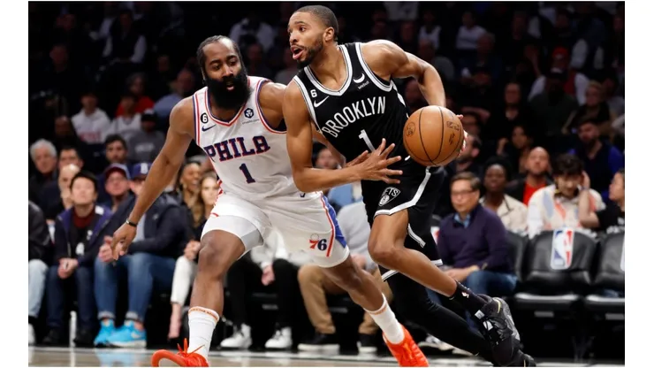 Mikal Bridges #1 of the Brooklyn Nets dribbles against James Harden #1 of the Philadelphia 76ers