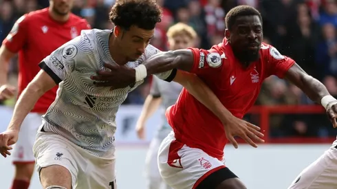 Curtis Jones of Liverpool and Serge Aurier of Nottingham Forest