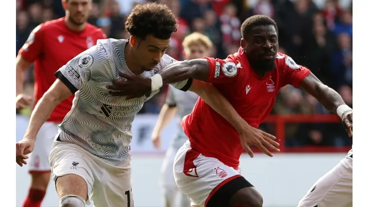 Curtis Jones of Liverpool and Serge Aurier of Nottingham Forest