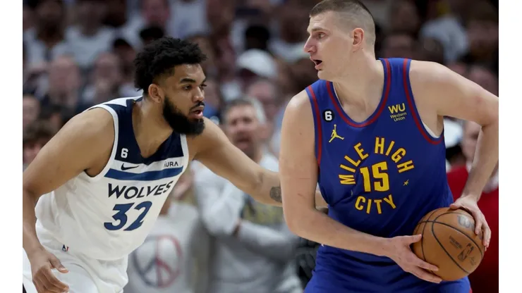 Karl-Anthony Towns of the Minnesota Timberwolves and Nikola Jokic of the Denver Nuggets