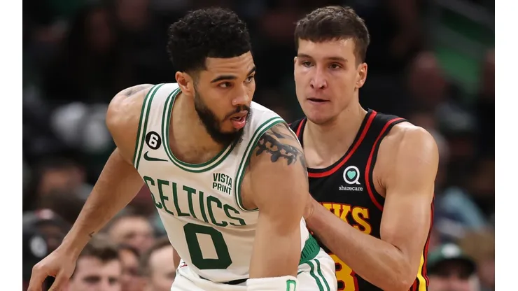 Jayson Tatum of the Boston Celtics and Bogdan Bogdanovic of the Atlanta Hawks