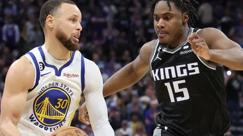 Stephen Curry of the Golden State Warriors and Davion Mitchell of the Sacramento Kings