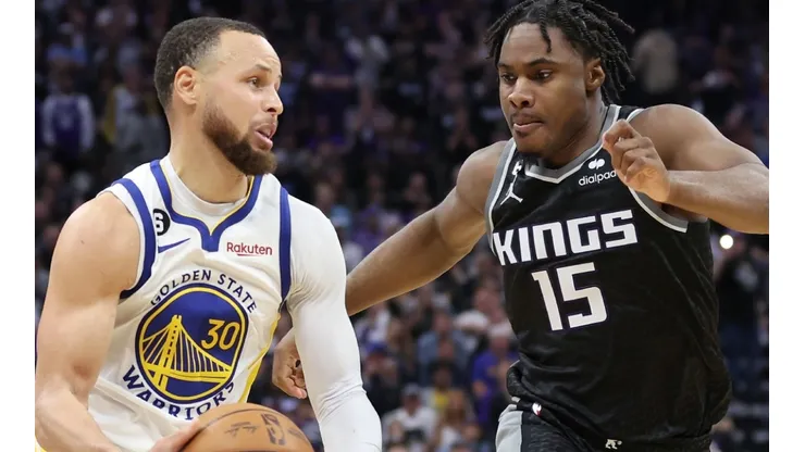 Stephen Curry of the Golden State Warriors and Davion Mitchell of the Sacramento Kings