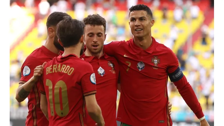 Cristiano Ronaldo of Portugal celebrates with Diogo Jota and Bernardo Silva.