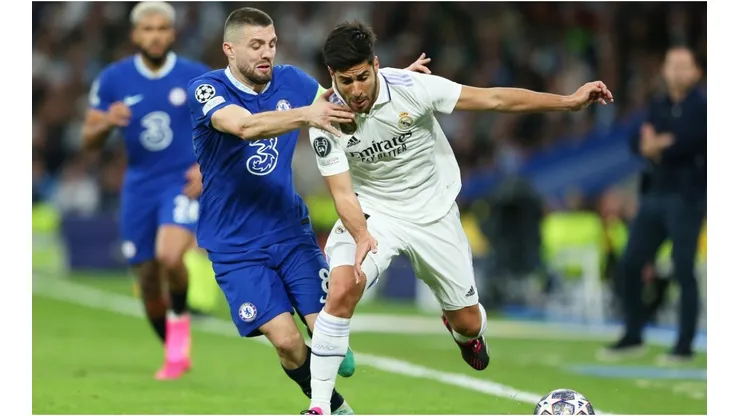 Marco Asensio of Real Madrid is challenged by Mateo Kovacic of Chelsea