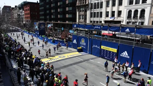 Runnings make their way down Boylston street to the finish line during the 126th Boston Marathon