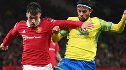 Lisandro Martinez of Manchester United and Gustavo Scarpa of Nottingham Forest