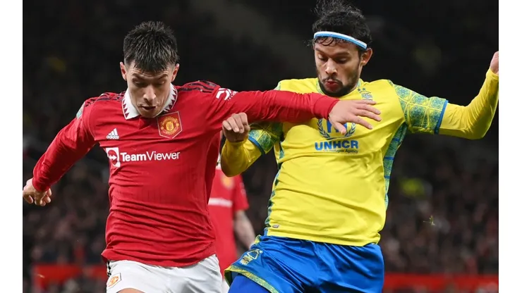 Lisandro Martinez of Manchester United and Gustavo Scarpa of Nottingham Forest
