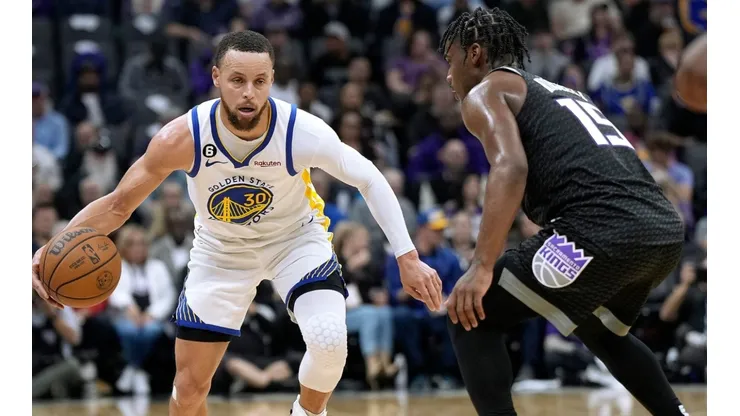 Stephen Curry and Davion Mitchell