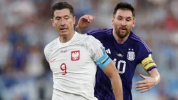 Lionel Messi of Argentina is challenged by Robert Lewandowski of Poland during the FIFA World Cup Qatar 2022 Group C match between Poland and Argentina at Stadium 974 on November 30, 2022 in Doha, Qatar.