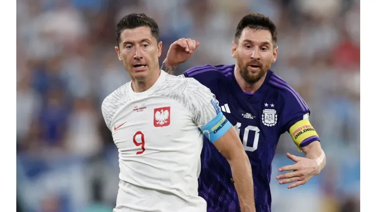 Lionel Messi of Argentina is challenged by Robert Lewandowski of Poland during the FIFA World Cup Qatar 2022 Group C match between Poland and Argentina at Stadium 974 on November 30, 2022 in Doha, Qatar.