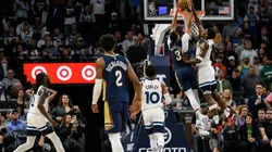 Anthony Edwards #1 of the Minnesota Timberwolves blocks a shot by CJ McCollum #3 of the New Orleans Pelicans