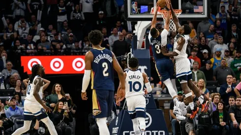 Anthony Edwards #1 of the Minnesota Timberwolves blocks a shot by CJ McCollum #3 of the New Orleans Pelicans