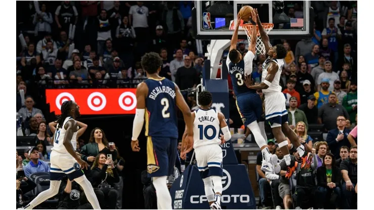 Anthony Edwards #1 of the Minnesota Timberwolves blocks a shot by CJ McCollum #3 of the New Orleans Pelicans