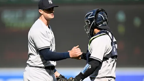Clay Holmes #35 of the New York Yankees celebrates with Jose Trevino