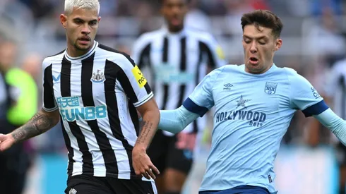 Bruno Guimaraes of Newcastle and Aaron Hickey of Brentford