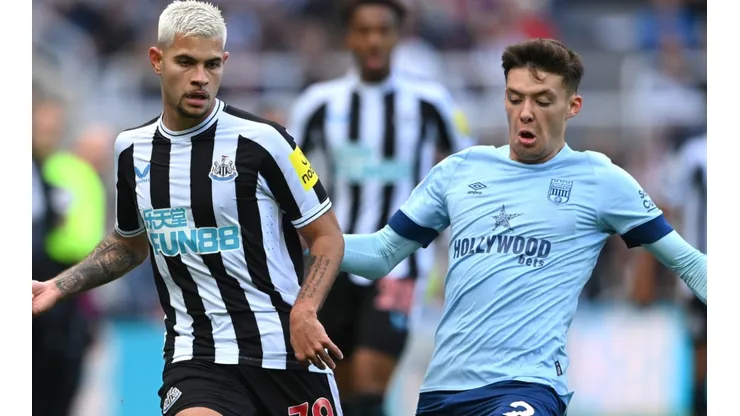 Bruno Guimaraes of Newcastle and Aaron Hickey of Brentford