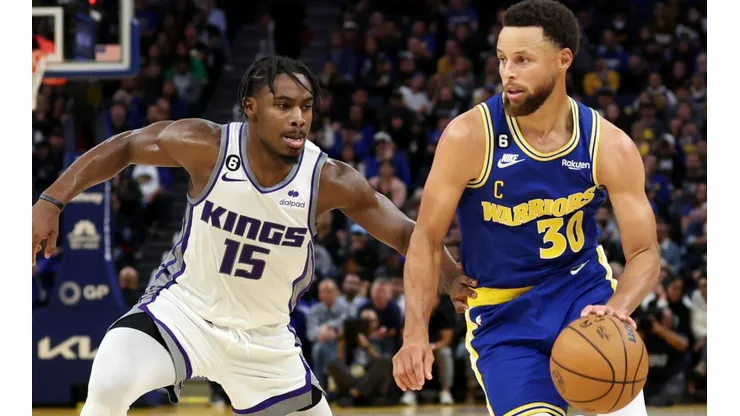 Davion Mitchell of the Sacramento Kings and Stephen Curry of the Golden State Warriors