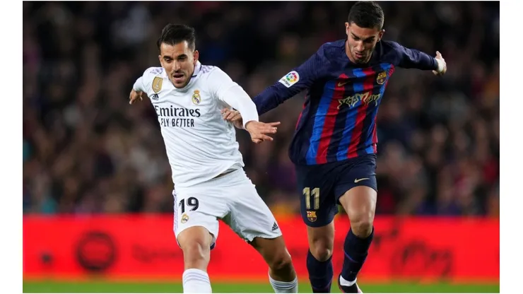Daniel Carvajal of Real Madrid battles for possession with Alejandro Balde of FC Barcelona