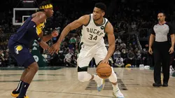 Giannis Antetokounmpo #34 of the Milwaukee Bucks is defended by Buddy Hield #24 of the Indiana Pacers