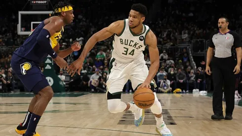 Giannis Antetokounmpo #34 of the Milwaukee Bucks is defended by Buddy Hield #24 of the Indiana Pacers