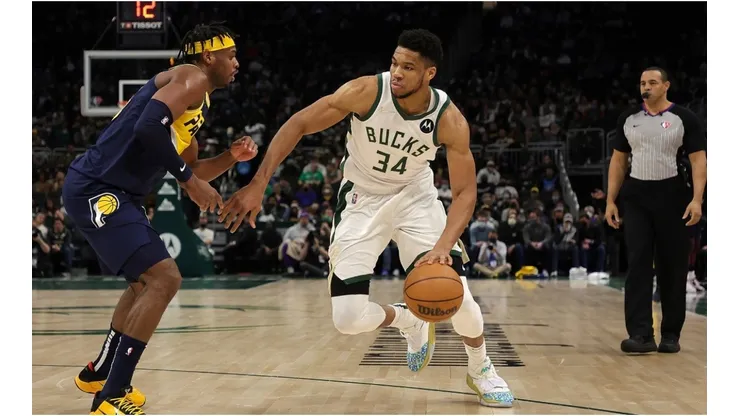 Giannis Antetokounmpo #34 of the Milwaukee Bucks is defended by Buddy Hield #24 of the Indiana Pacers