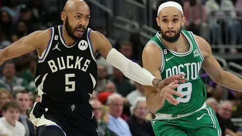 Jevon Carter of the Milwaukee Bucks and Derrick White of the Boston Celtics