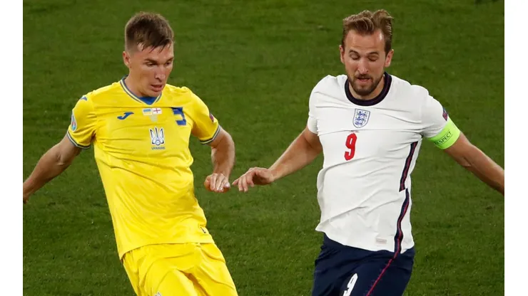 Heorhii Sudakov of Ukraine and Harry Kane of England