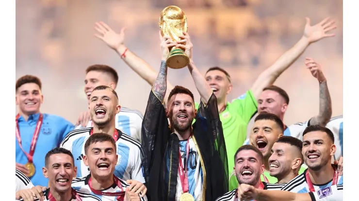 Lionel Messi lifts the FIFA World Cup trophy at Qatar 2022.