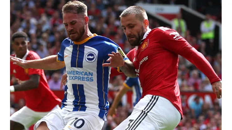 Alexis Mac Allister of Brighton and Luke Shaw of Manchester United