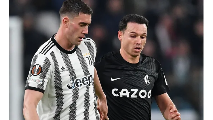 Dusan Vlahovic of Juventus and Nicolas Hoefler of Freiburg
