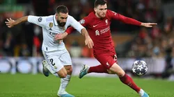 Andrew Robertson of Liverpool runs with the ball whilst under pressure from Daniel Carvajal of Real Madrid