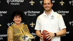 QB Derek Carr next to Saints owner Gayle Benson
