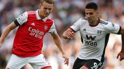 Martin Odegaard of Arsenal and Aleksandar Mitrovic of Fulham