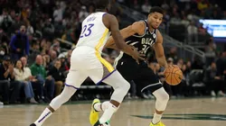 Giannis Antetokounmpo of the Milwaukee Bucks is defended by Draymond Green