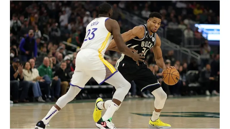Giannis Antetokounmpo of the Milwaukee Bucks is defended by Draymond Green