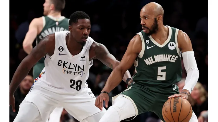 Dorian Finney-Smith of the Brooklyn Nets and Jevon Carter of the Milwaukee Bucks
