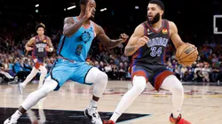 Kenrich Williams #34 of the Oklahoma City Thunder handles the ball against Terrence Ross #8 of the Phoenix Suns