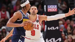 Nikola Vucevic #9 of the Chicago Bulls defends Zeke Nnaji #22 of the Denver Nuggets