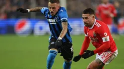 Noa Lang of Club Brugge is tackled by Nicolas Otamendi of Benfica