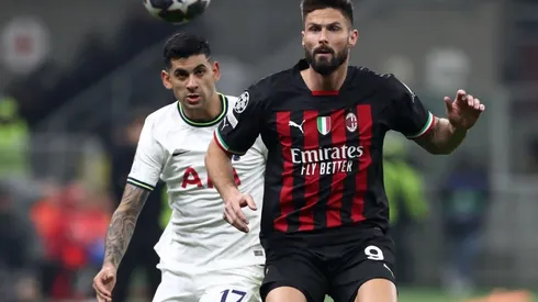 Olivier Giroud of AC Milan battles for possession with Cristian Romero of Tottenham Hotspur