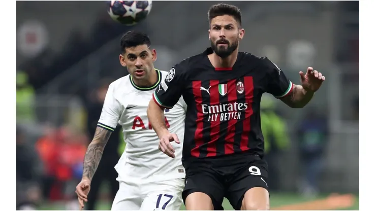 Olivier Giroud of AC Milan battles for possession with Cristian Romero of Tottenham Hotspur