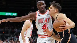 Bogdan Bogdanovic #13 of the Atlanta Hawks draws a foul from Victor Oladipo #4 of the Miami Heat