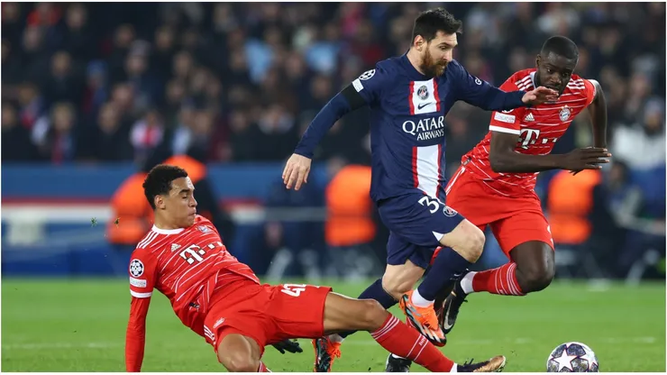 Lionel Messi of Paris Saint-Germain is challenged by Jamal Musiala and is marked by Dayot Upamecano of FC Bayern Munich