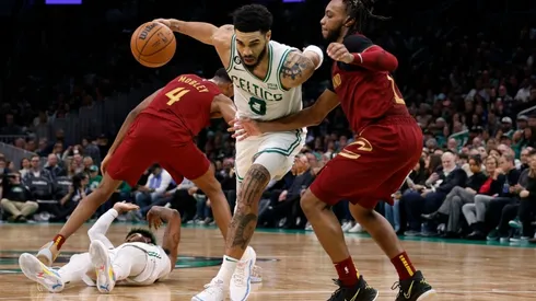 Jayson Tatum #0 of the Boston Celtics drives on Darius Garland #10 of the Cleveland Cavaliers