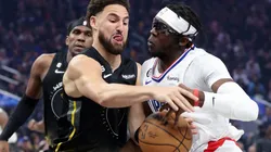 Klay Thompson of the Golden State Warriors and Reggie Jackson of the LA Clippers