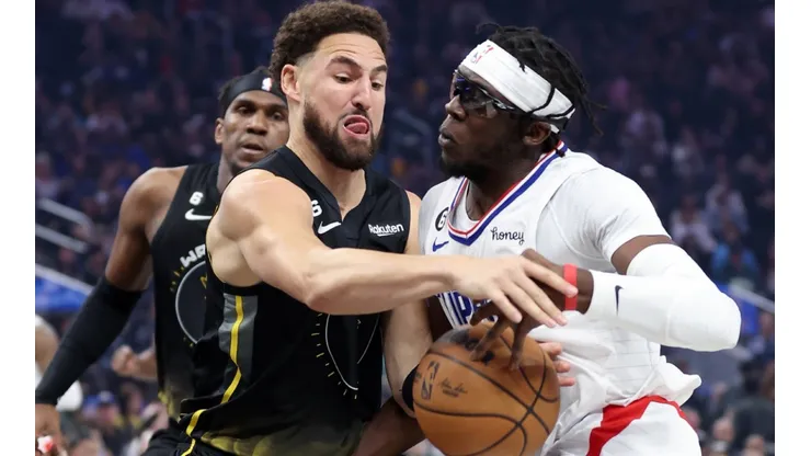 Klay Thompson of the Golden State Warriors and Reggie Jackson of the LA Clippers