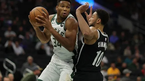 Giannis Antetokounmpo #34 of the Milwaukee Bucks is defended by Ben Simmons #10 of the Brooklyn Nets